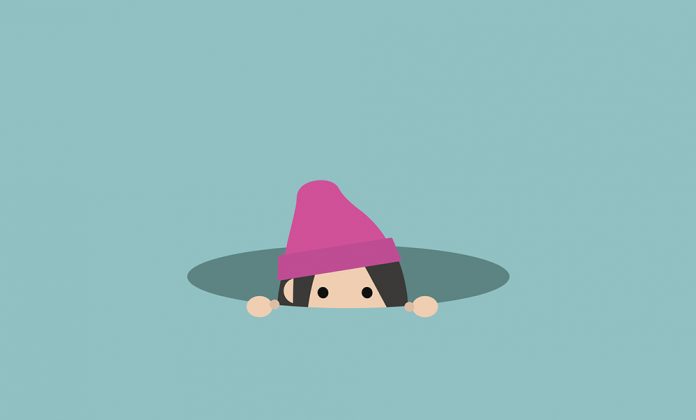 Curious girl hiding in the hole and prying